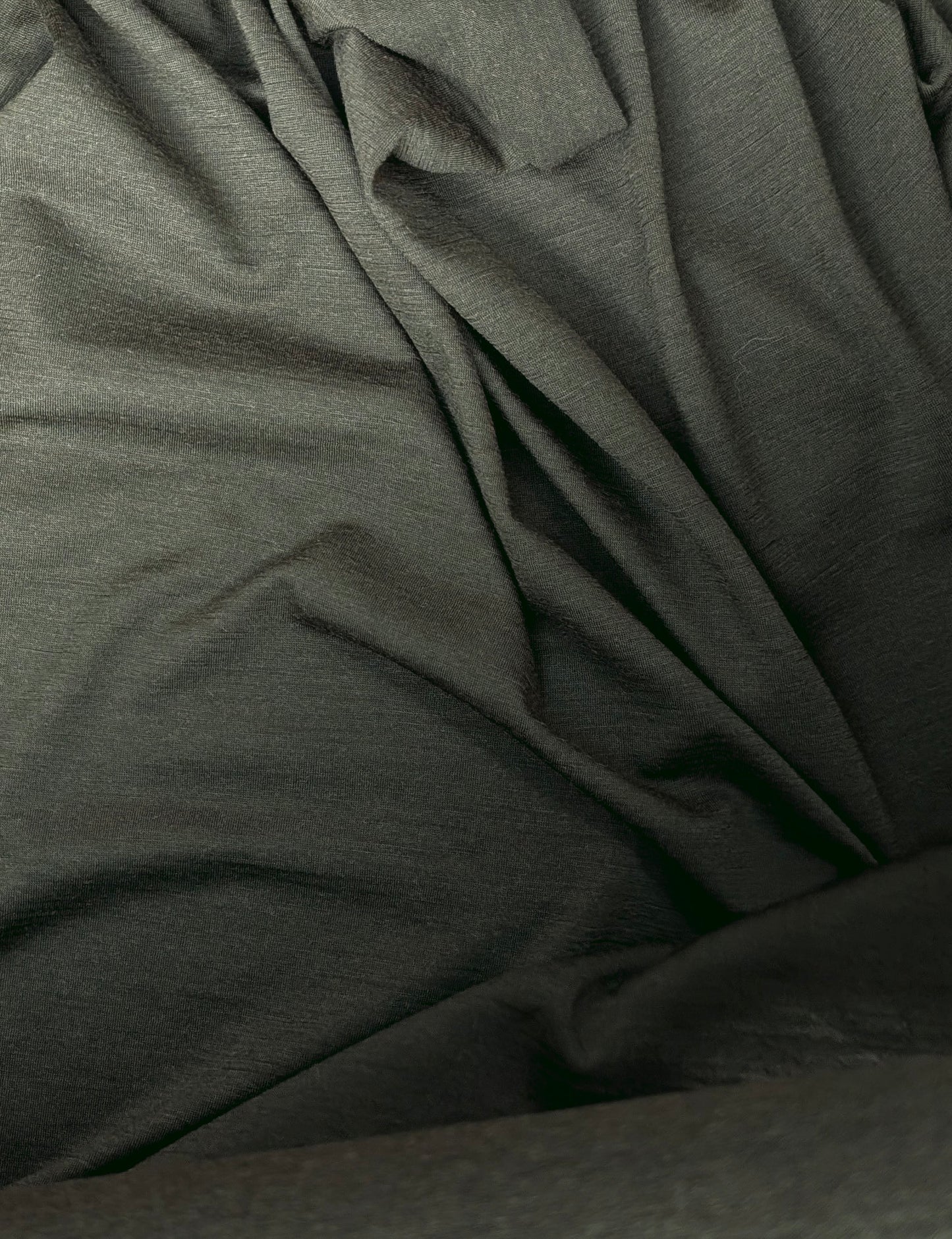 olive merino fabric scrunched slightly