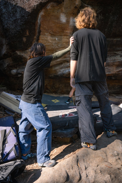 a couple assessing a boulding wall