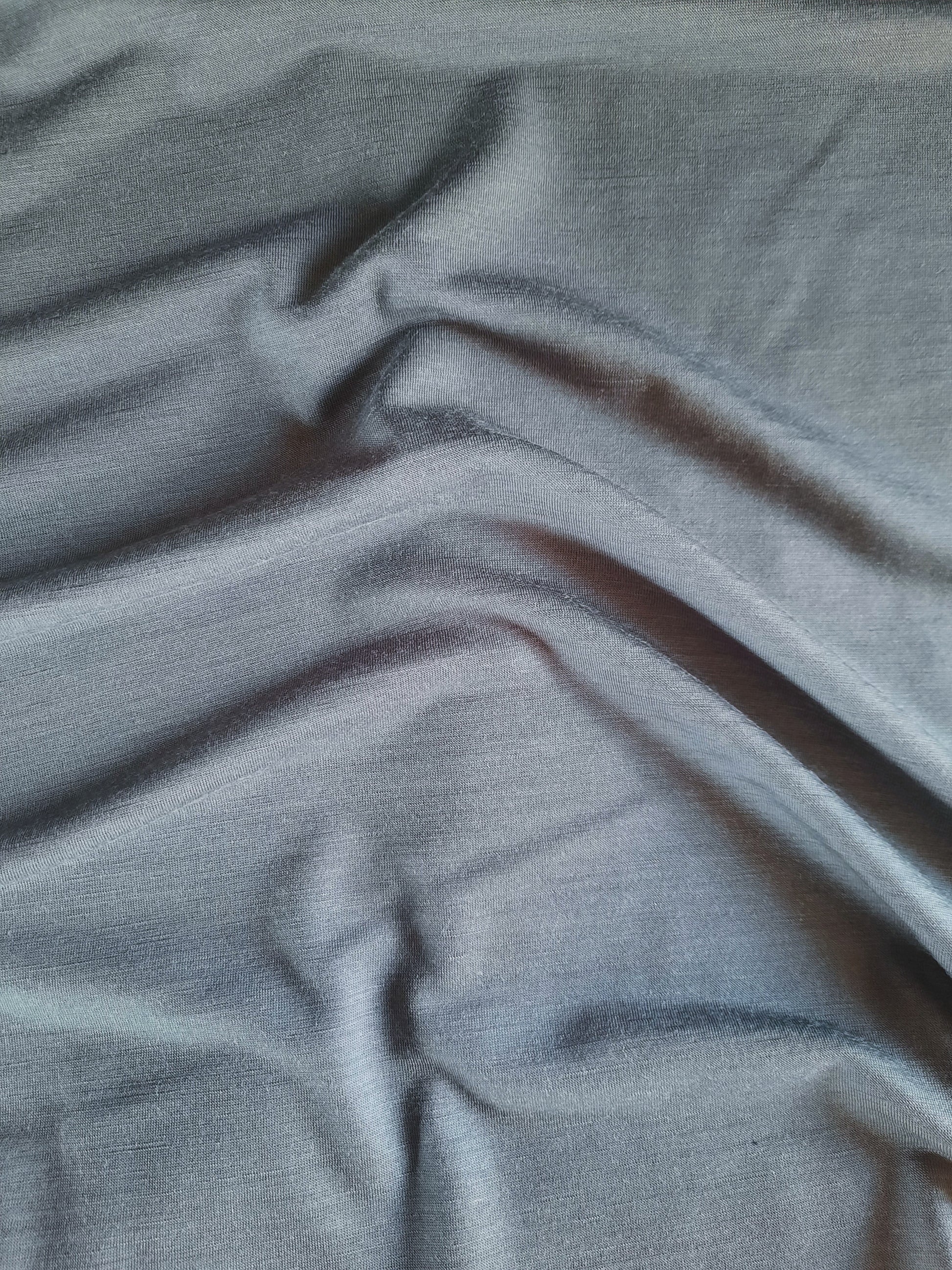 A closeup image of slate merino with creases to show colour variance